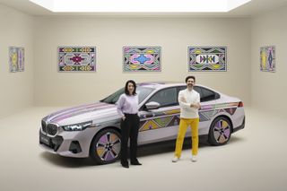 Stella Clarke and Renzo Vitale with the BMW i5 Flow NOSTOKANA