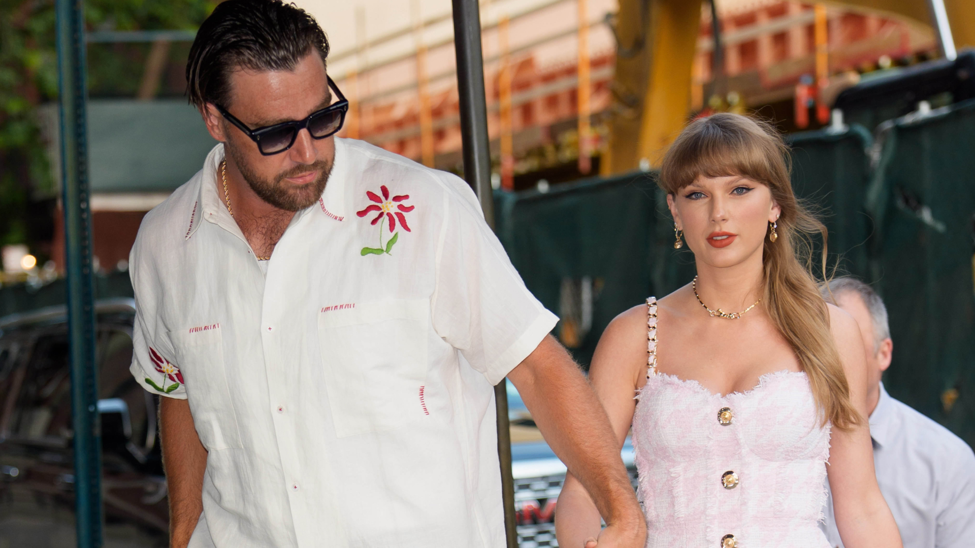 Taylor Swift and Travis Kelce hold hands as they walk to a lunch date on June 28