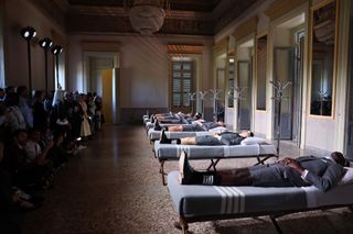 Thom Browne Frette Homeware Milan Design Week 2024 presentation: models lie on beds