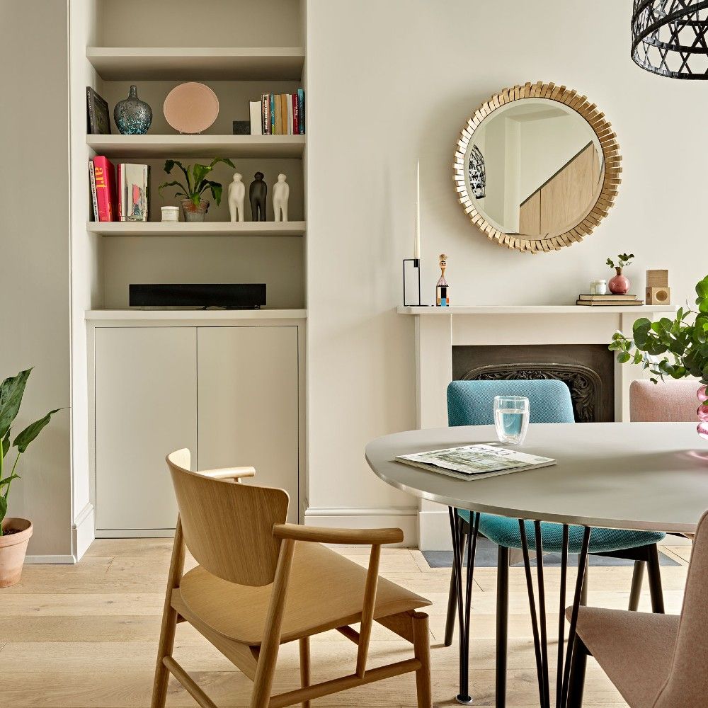 dining area with fireplace and storage shelves