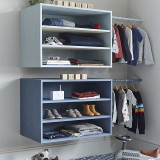 grey wall room with blue shelf and cloth hanger