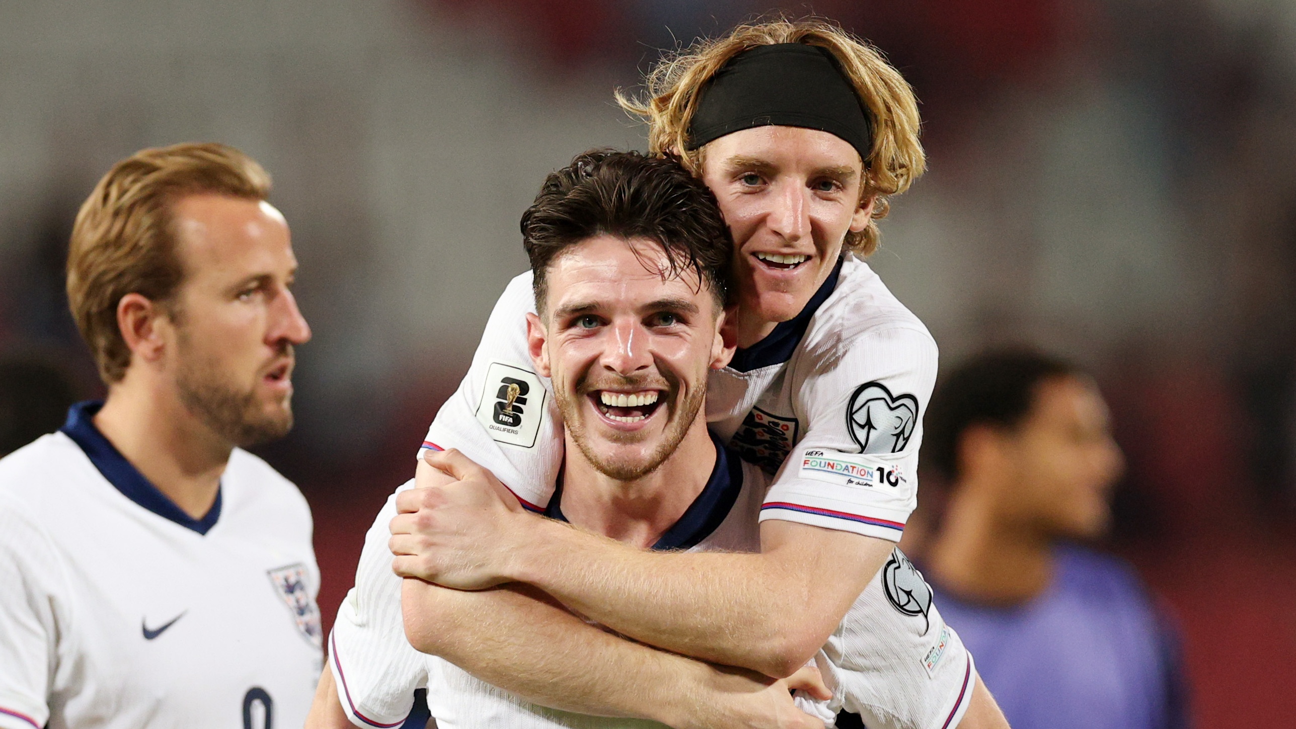 Declan Rice of England celebrates with teammate Anthony Gordon following the team's victory in the FIFA World Cup 2026 qualifier match between Serbia and England at Rajko Mitic Stadium on September 09, 2025 in Belgrade, Serbia.