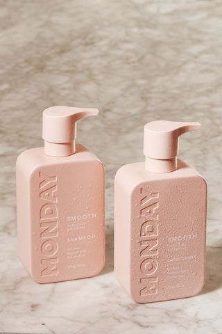 monday hair care in pink bottles