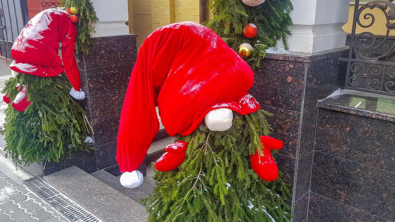 christmas trees with hats outside door