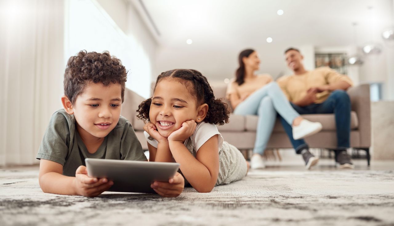 Children playing together on an ipad