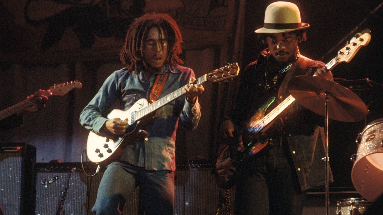 Aston 'Family Man' BARRETT and Bob MARLEY, Bob Marley performing live on stage at the Odeon with bass player, Aston 'Family Man' Barrett