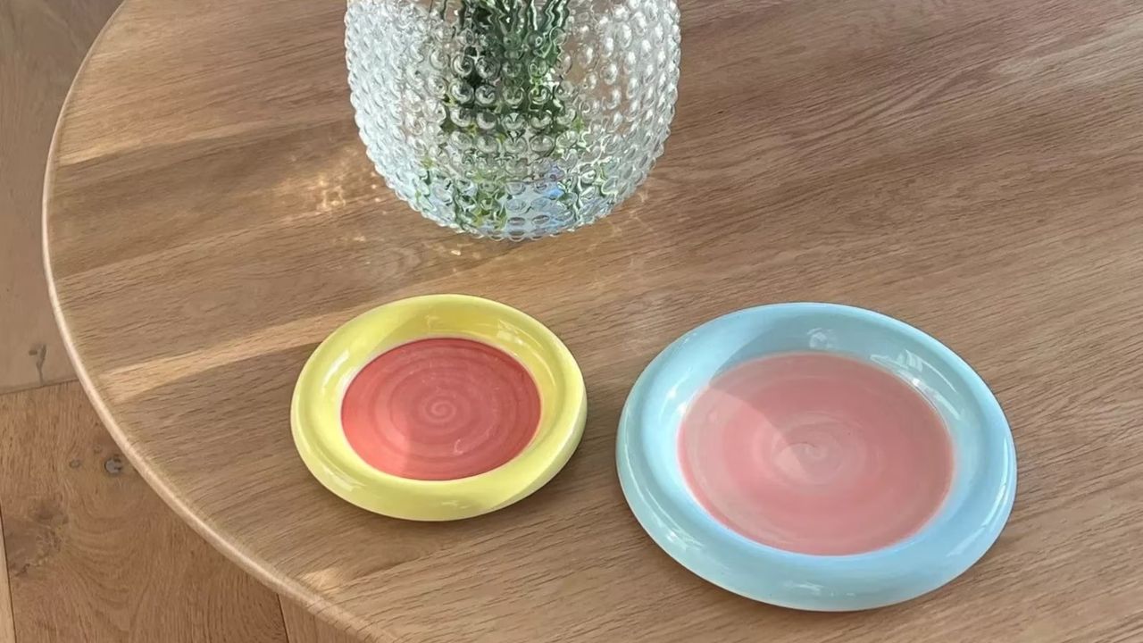 Cornflower Ceramics bubble plates on a wooden table with a vase next to them