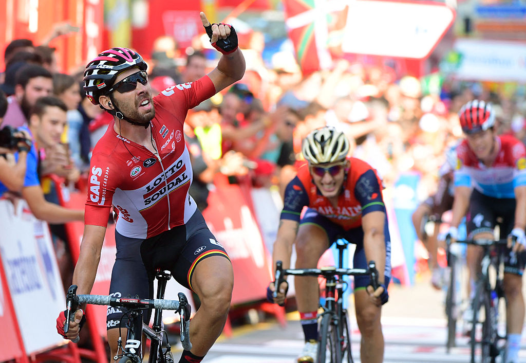 Belgium's Thomas De Gendt (L) of team LottoSoudal celebrates as he crosses the finish line to win the 19th stage of the 72nd edition of "La Vuelta" Tour of Spain cycling race, a 149.7 km route from Caso, Parque Natural de Redes, to Gijon, on September 8, 2017. (Photo by JOSE JORDAN / AFP) (Photo by JOSE JORDAN/AFP via Getty Images)