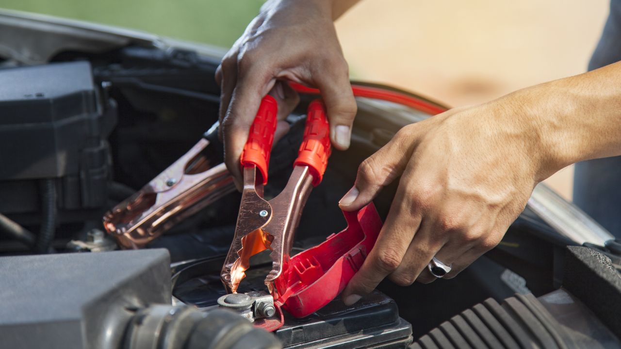 best jump starter: person using a Jump starter