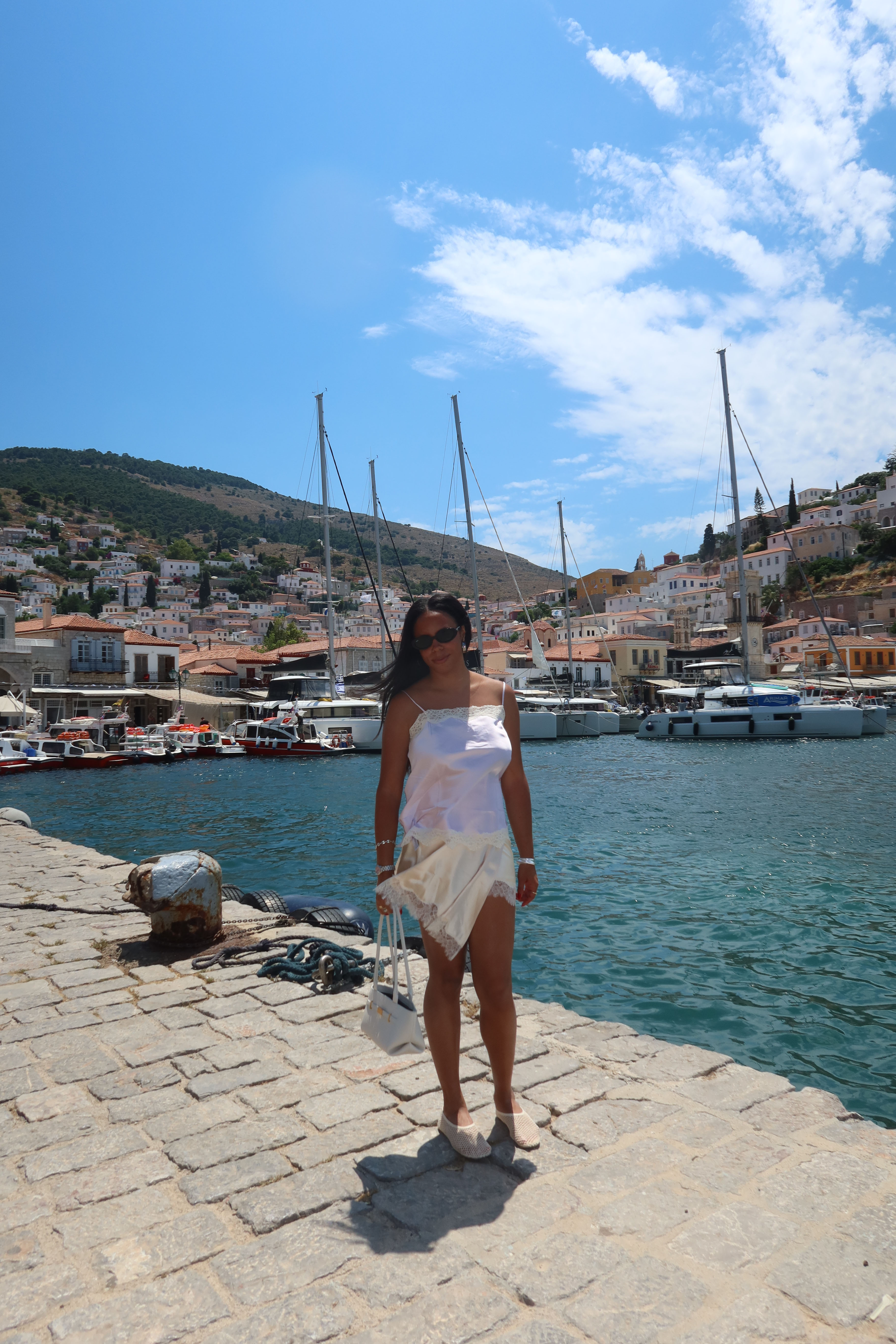 Sierra Mayhew wearing a stylish outfit in Greece.