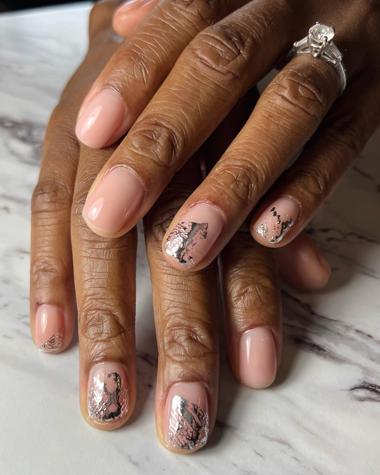 A metallic snake manicure by Elle Gerstein