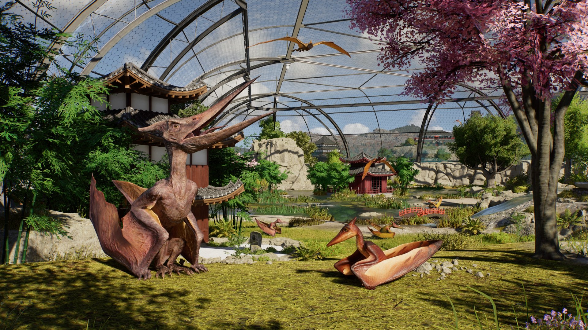 Jurassic World Evolution 3 screenshot of baby pterodactyl with an adult pterodactyl in a park set in Japan