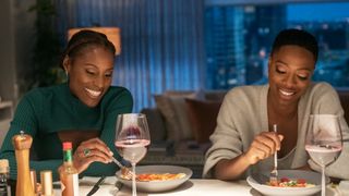Issa Rae and Yvonne Orji eat a meal on Insecure season 5 episode 2