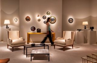 An installation view of a design gallery's show presents a series of artworks straddling contemporary and antique looks.