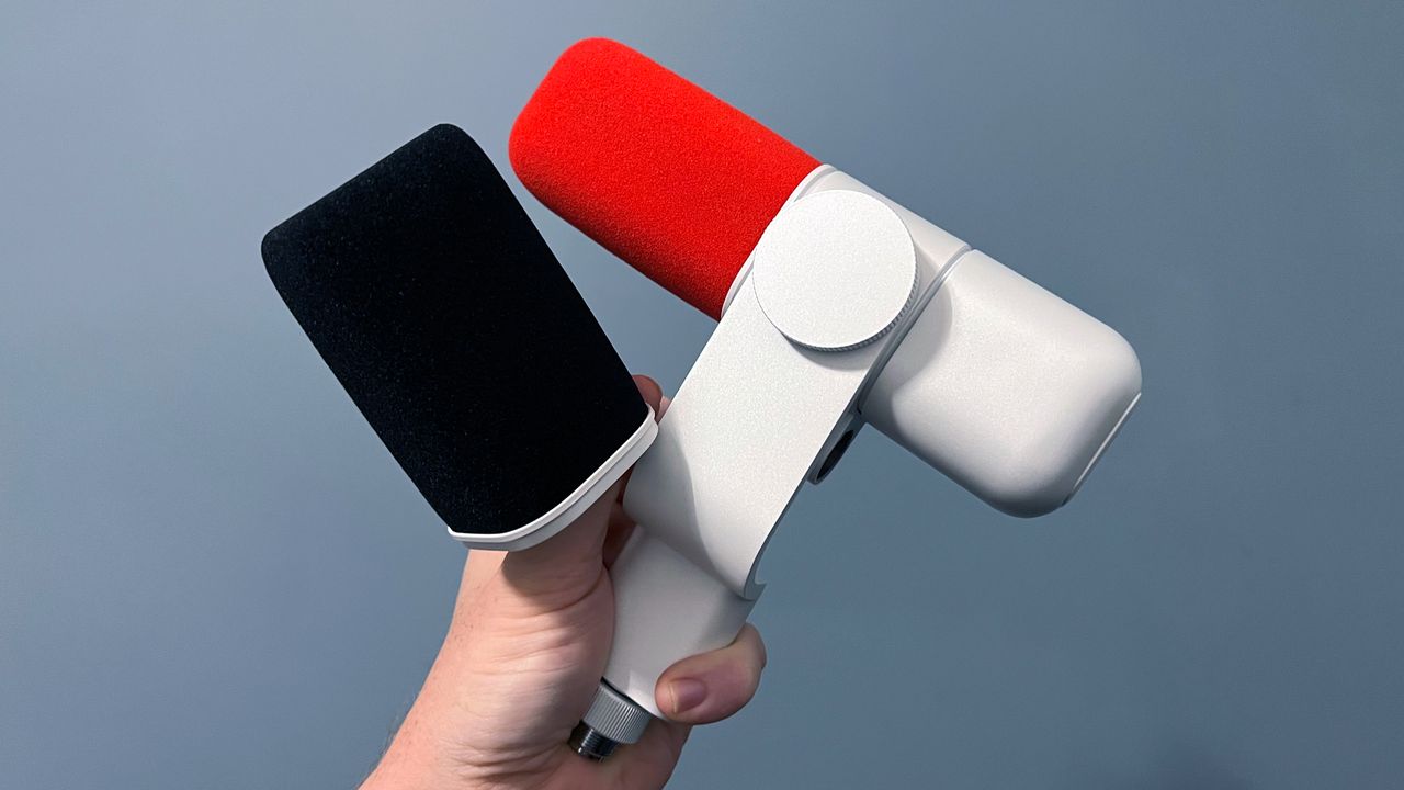 Logitech Blue Sona microphone held against a grey backdrop