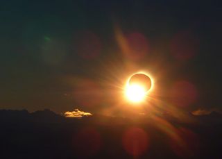 Photo of total solar eclipse as the annular phase/third contact ends.