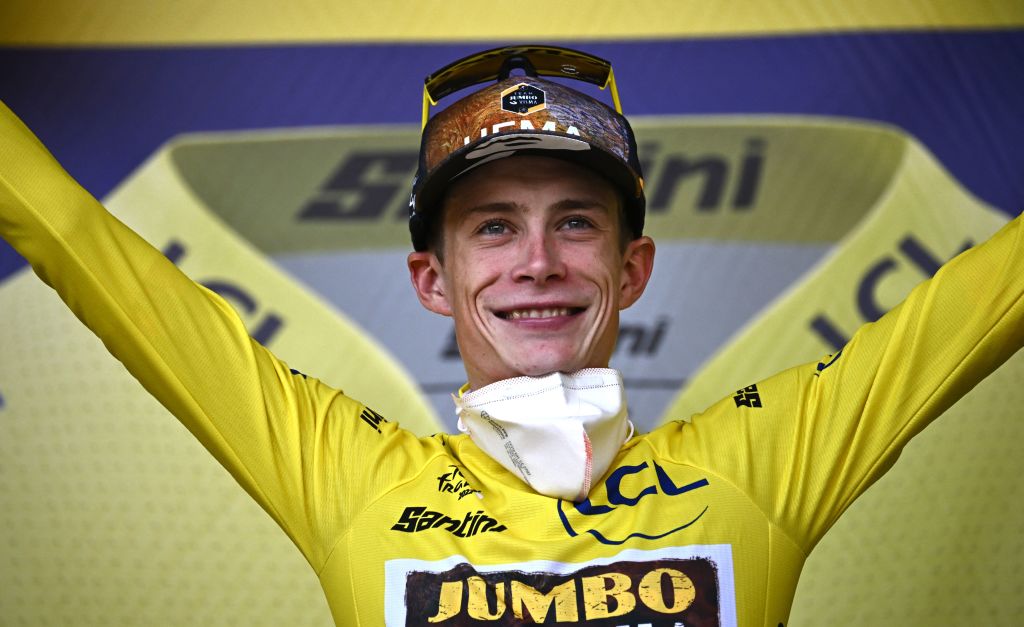 JumboVisma teams Danish rider Jonas Vingegaard celebrates on the podium with the overall leaders yellow jersey after the 16th stage of the 109th edition of the Tour de France cycling race 1785 km between Carcassonne and Foix in southern France on July 19 2022 Photo by AnneChristine POUJOULAT AFP Photo by ANNECHRISTINE POUJOULATAFP via Getty Images