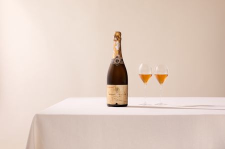 bottle of 1926 Ruinart with glasses