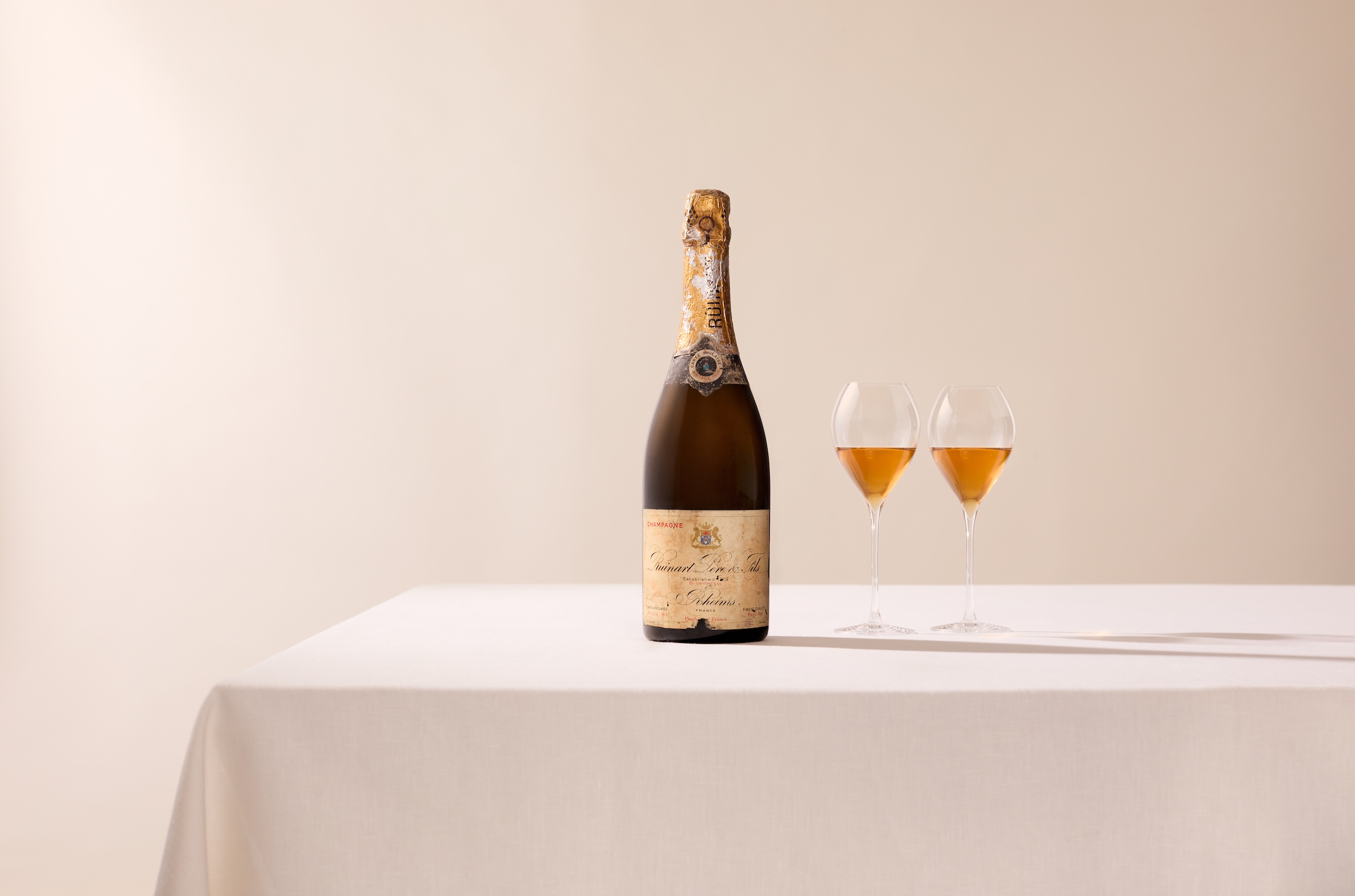 bottle of 1926 Ruinart with glasses