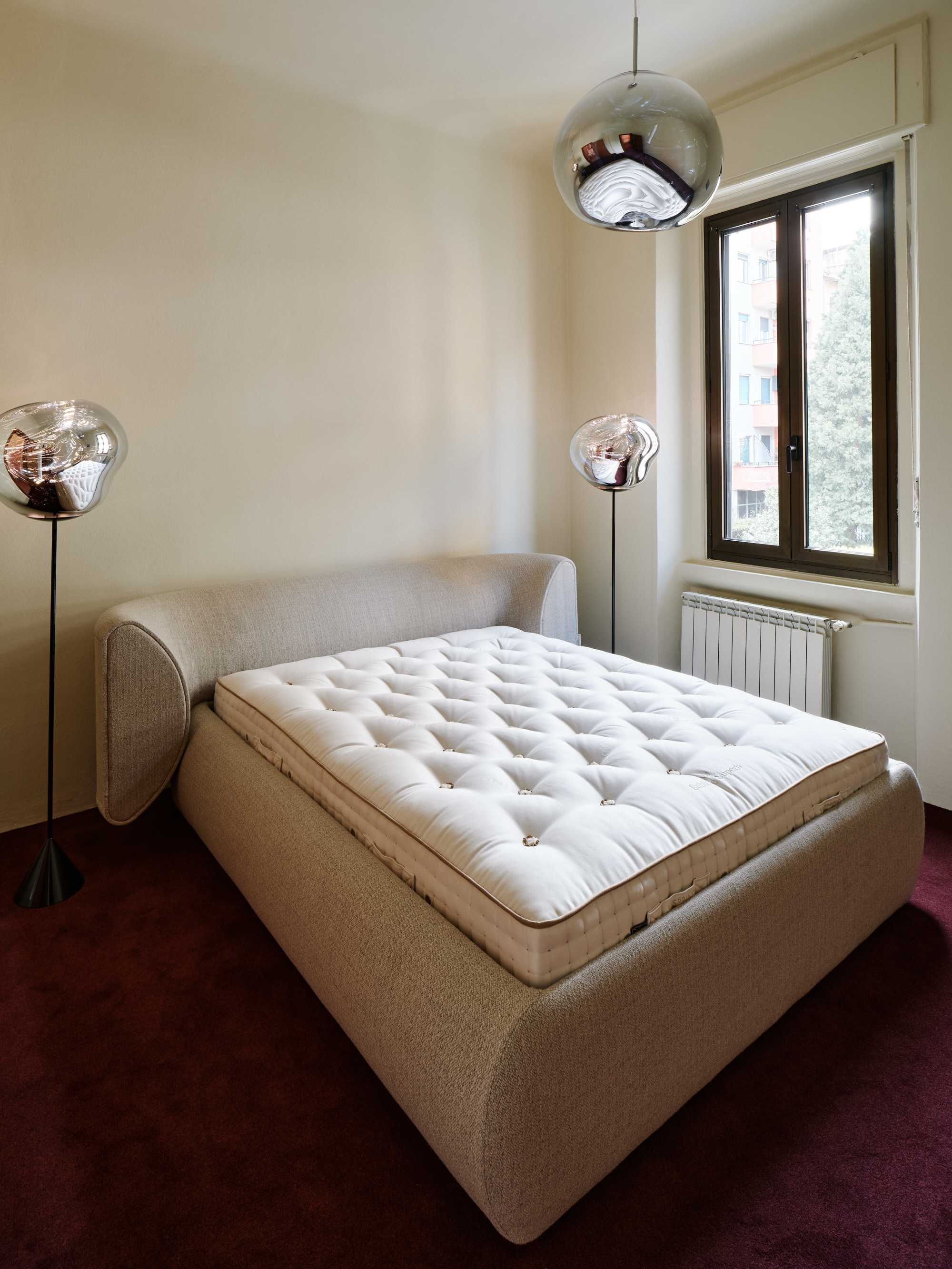 Inside Mua Mua Hotel designed by Tom Dixon for Milan Design Week 2026, featuring Tom Dixon x Vispring bed collaboration