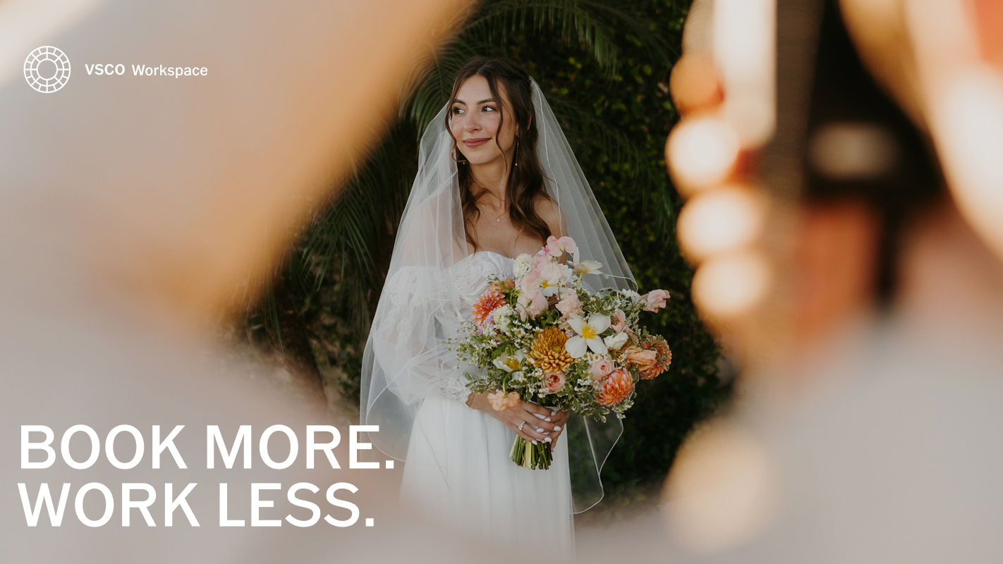 A photo of a wedding photographer photographing a bride