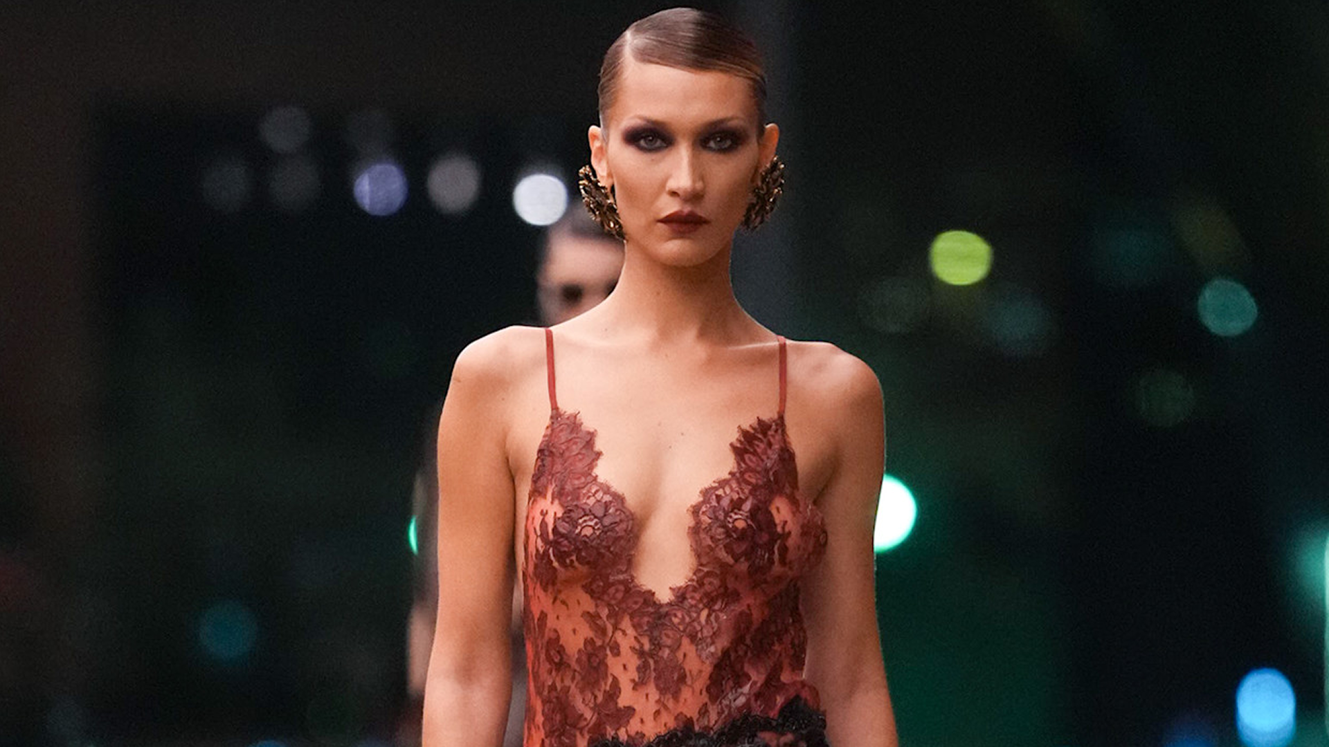 Bella Hadid returned to Saint Laurent's runway in a lingerie-inspired, Fall 2026 lace skirt set 