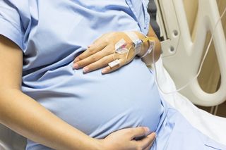 A pregnant woman in the hospital.