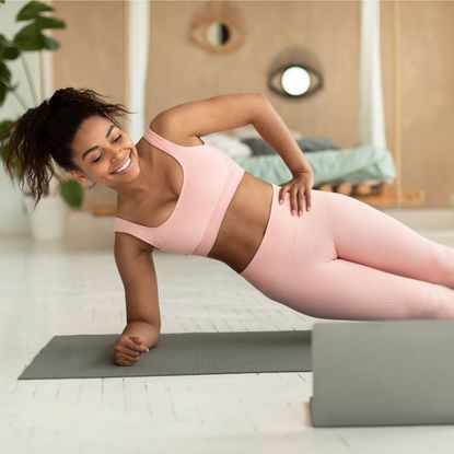 Pilates workouts at home: A woman doing a home workout