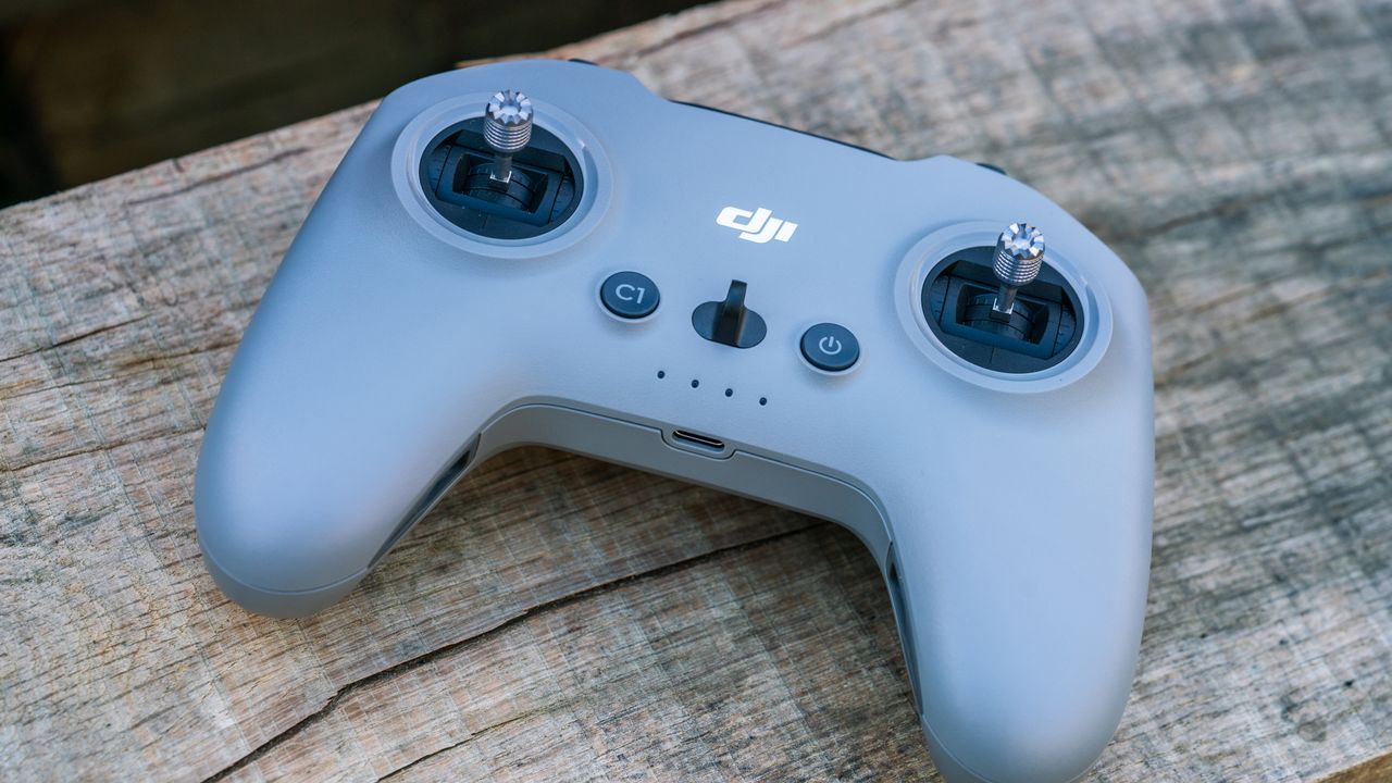 DJI Avata 2 FPV drone controller on a wooden bench
