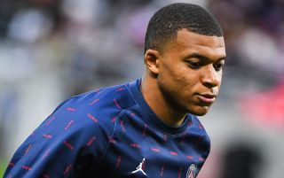 PSG forward Kylian Mbappe warming up