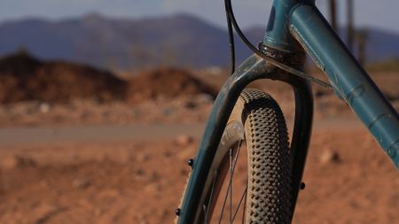 Image shows gravel bike tire with intermediate tread pattern