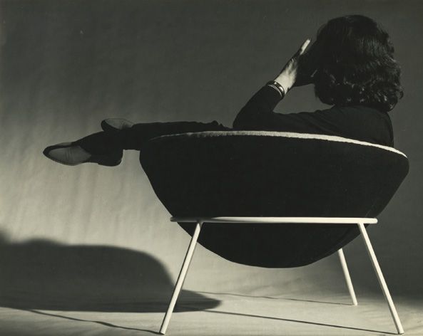 Lina Bo Bardi reclines in the semi-spherical &#039;Bowl Chair&#039;