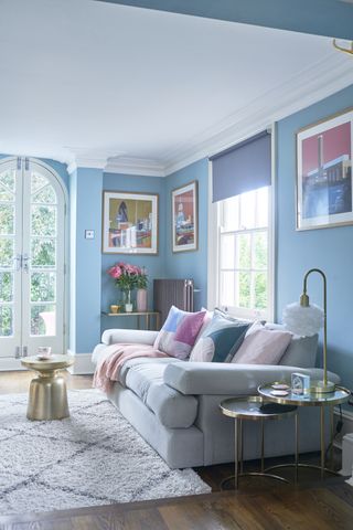 blue living room with grey sofa