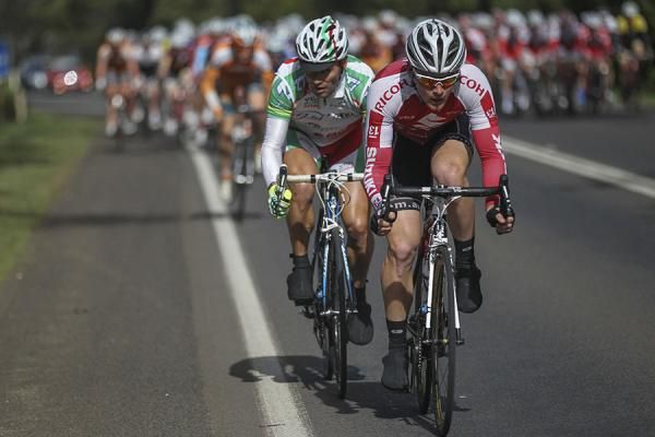 A few riders attempt to move away from the bunch