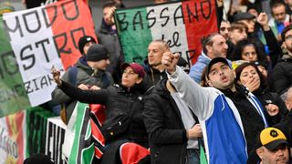 Italy supporters in the stand at a football match