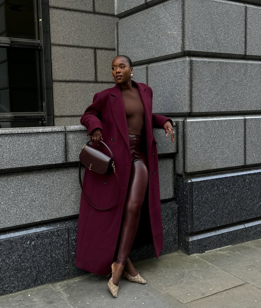 Flora in burgundy red leggings and outfit