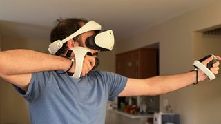 The author aiming a bow and arrow with the Sony PS VR2 Sense controllers.