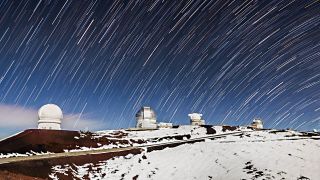 Star trails over the Gemini North telescope and five other observatoris on Mauna Kea, Hawaii.