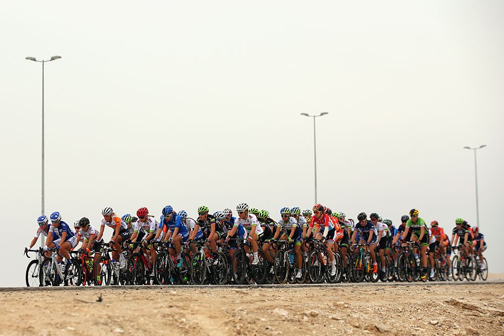 Ladies Tour of Qatar stage 2 - peloton riding flat, windy course conditions