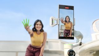 Person waving at Insta360 Flow 2 Pro with hand highlighted suggesting AI has spotted it