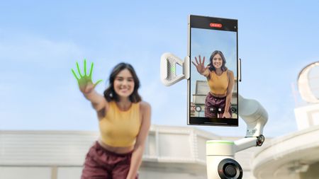 Person waving at Insta360 Flow 2 Pro with hand highlighted suggesting AI has spotted it