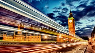 Image of UK Parliament with lights representing fast speeds