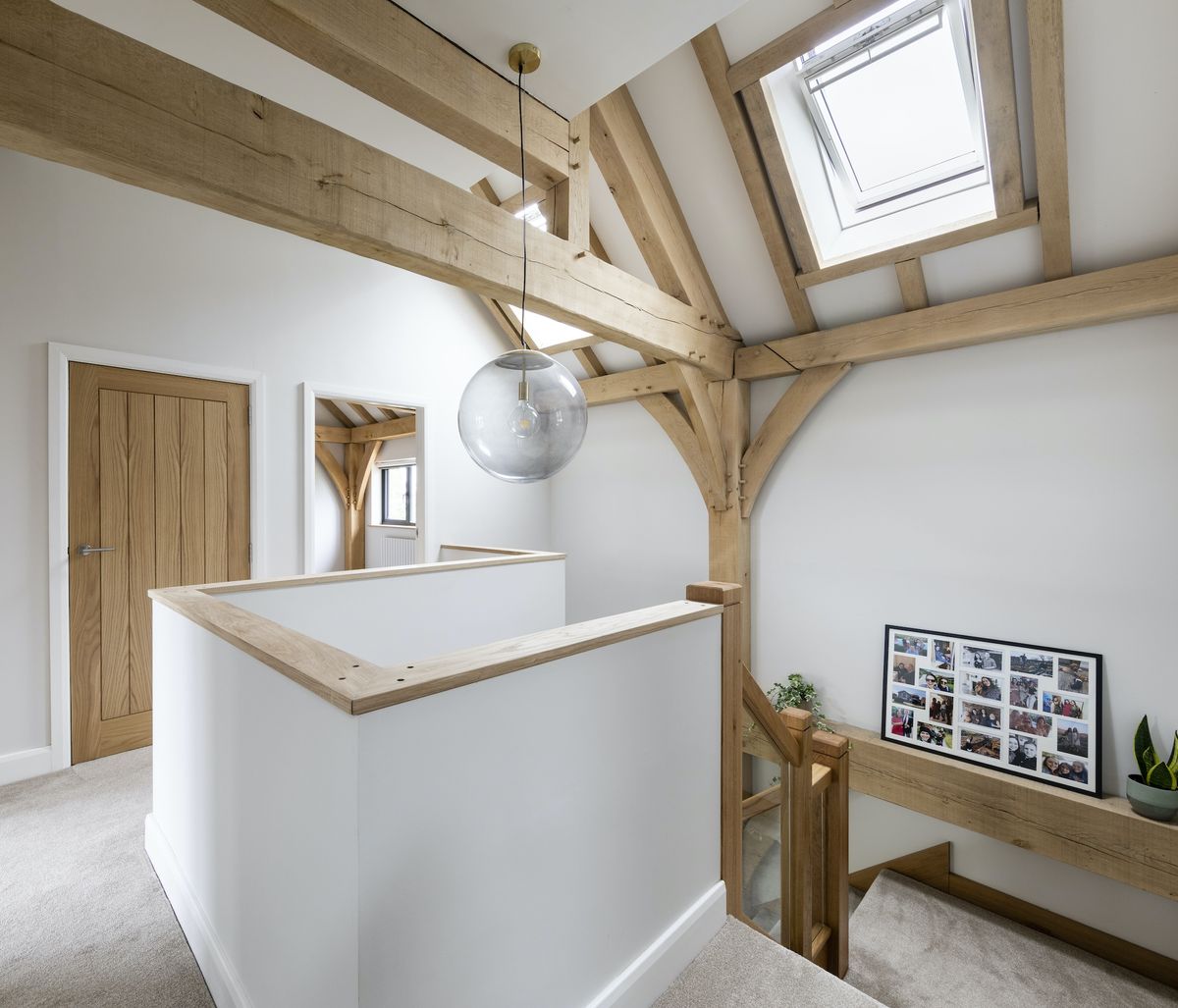 Upstairs, bedrooms sit around a central stairwell