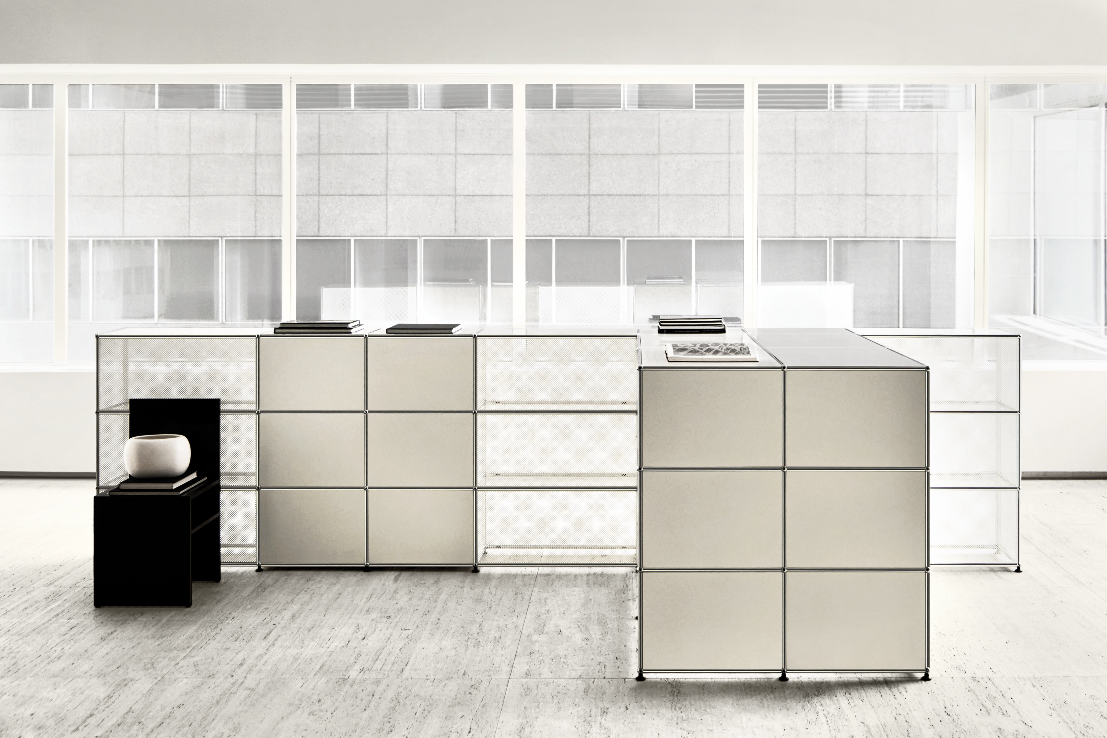 Black and white office space furnished with USM Haller system