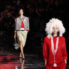 a model wearing chanel on the runway