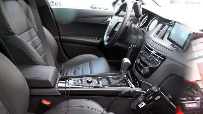 Inside this Omega Pharma-QuickStep team car are multiple radios plus a small television