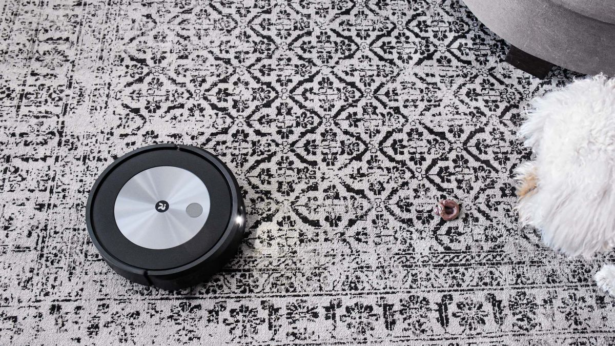 iRobot Roomba j7+ on carpet with light on