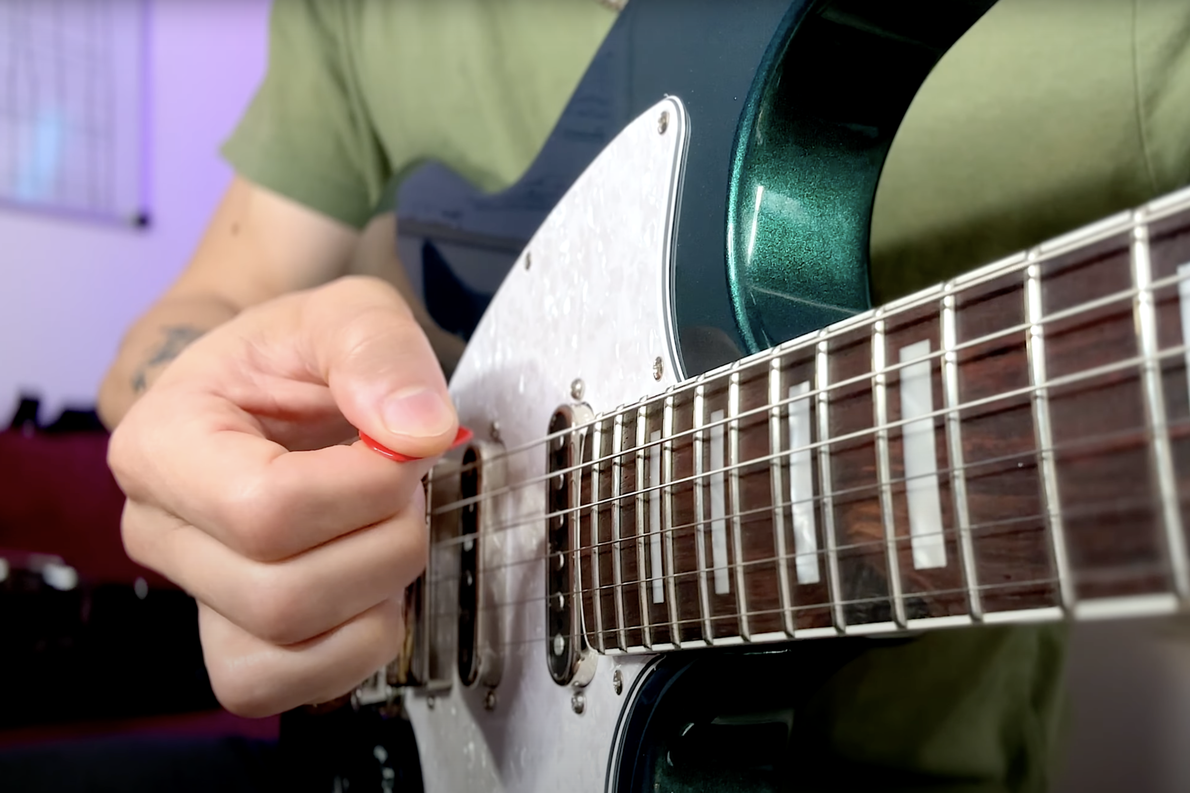 holding a pick