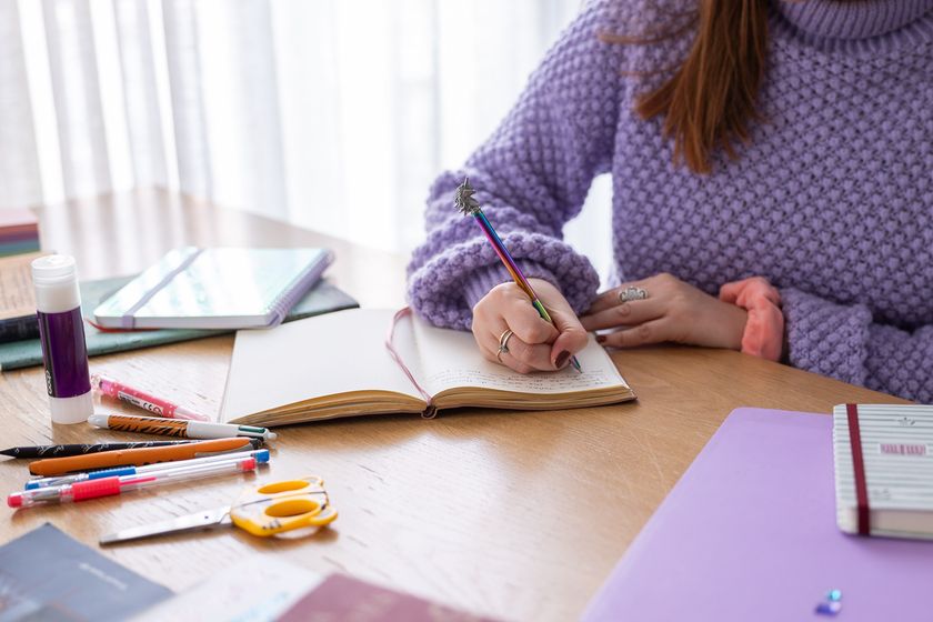 woman writing in a journal