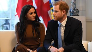 Prince Harry, Duke of Sussex and Meghan, Duchess of Sussex gesture during their visit to Canada House